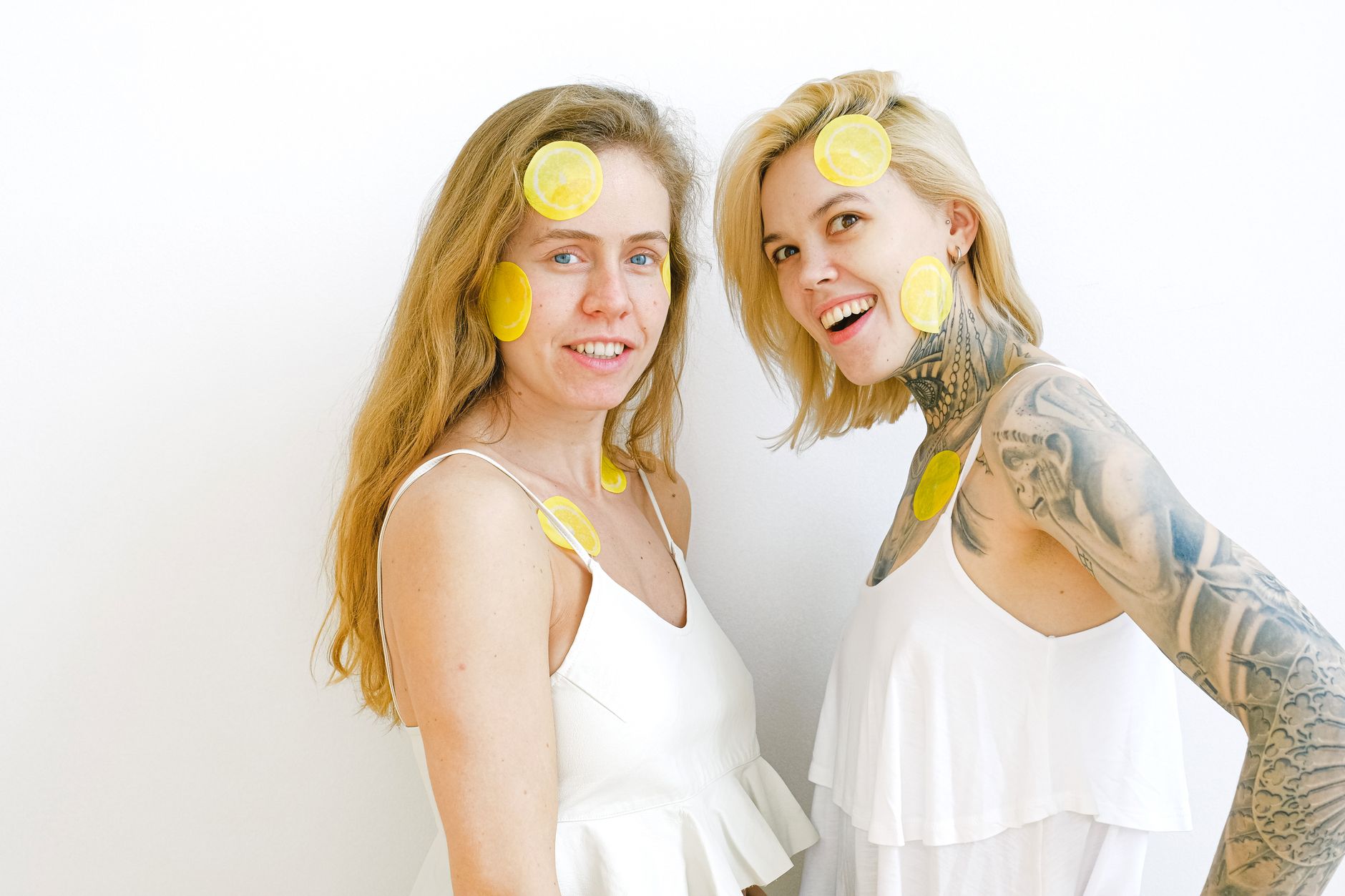 Colorful arrangement of lemon vibrators and sensual objects on a bright yellow background